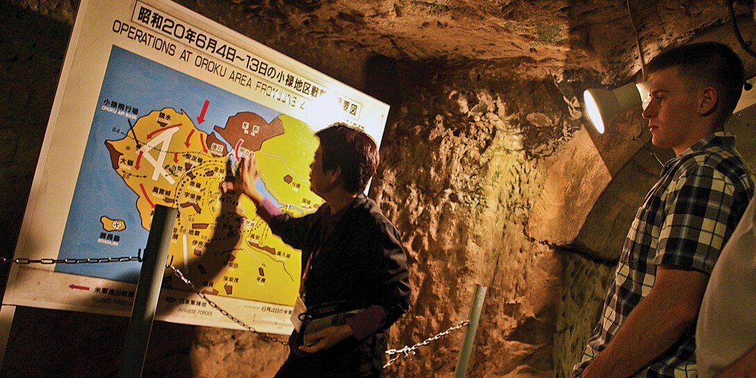 Setsuko Inafuku explains different operations that took place during the Battle of Okinawa while leading a battle sites tour Nov. 13 at the site of the former Japanese Navy Underground Headquarters.