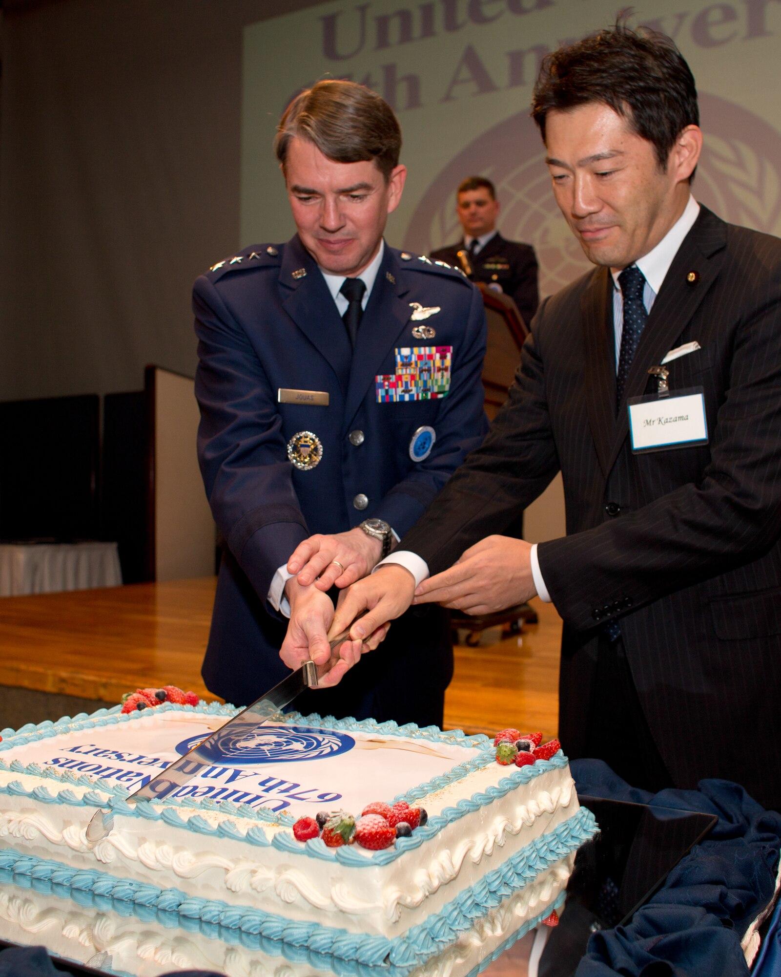 TOKYO, Japan -- (left to right) U.S. Air Force Lt. Gen. Jan-Marc Jouas, United Nations Command Korea, deputy commander, U.S. Forces Korea, deputy commander, Air Component Command, Republic of Korea/U.S. Combined Forces Command, commander, 7th Air Force, commander, and Naoki Kazama, Vice-Minister for Foreign Affairs of Japan, cut the ceremonial cake to commemorate the 67th Anniversary of the United Nations, Nov. 29, 2012 at New Sanno Hotel. (U.S. Air Force photo by Osakabe Yasuo) 