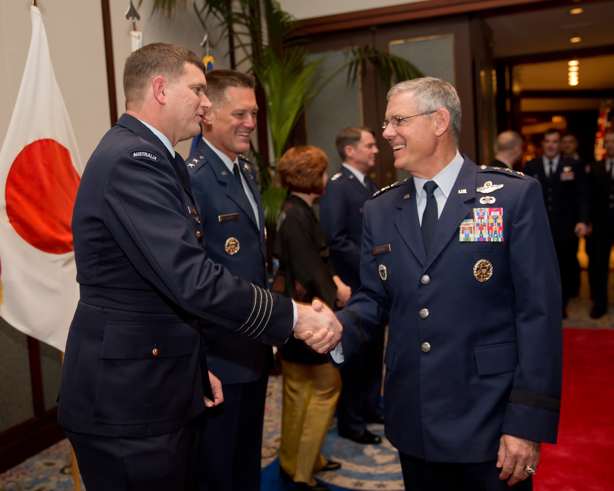 TOKYO, Japan -- (from left to right) Royal Australian Air Force Group Captain Luke Stoodley, United Nations Command (Rear) commander, greets U.S. Air Force Lt. Gen. Sam Angelella, U.S. Forces, Japan and 5th Air Force commander, during the 67th Anniversary of the United Nations, Nov. 29, 2012 at New Sanno Hotel. The United Nations Command (Rear) provides liaison and maintains a special UN Forces - Government of Japan Status of Forces Agreement which enables forces of UN member nations to use seven U.S. installations in Japan as UNC supporting facilities in the event of a resumption of hostilities. (U.S. Air Force photo by Osakabe Yasuo)