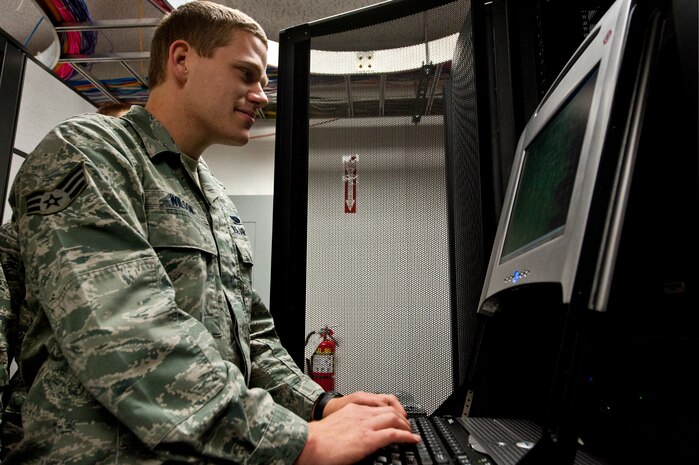 Senior Airman Kyle Wilson, 99th Communications Squadron network technician, checks a server’s status Nov. 20, 2012, at Nellis Air Force Base, Nev. The 99th Communications Squadron operates and maintains the base computer networks, wired and wireless telecommunications systems and networks, airfield and radar systems, as well as provides postal services. (U.S. Air Force photo by Airman 1st Class Jason Couillard) 