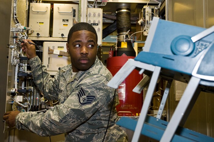 Staff Sgt. Darrien Miller, 99th Communications Squadron radar maintenance non-commissioned officer in charge, performs a preventive maintenance inspection on the Airfield Surveillance Radar Nov. 19, 2012, at Nellis Air Force Base, Nev. The ASR-9 combines circular polarization with moving target detection for vastly improved aircraft detection in weather conditions. (U.S. Air Force photo by Airman 1st Class Christopher Tam)