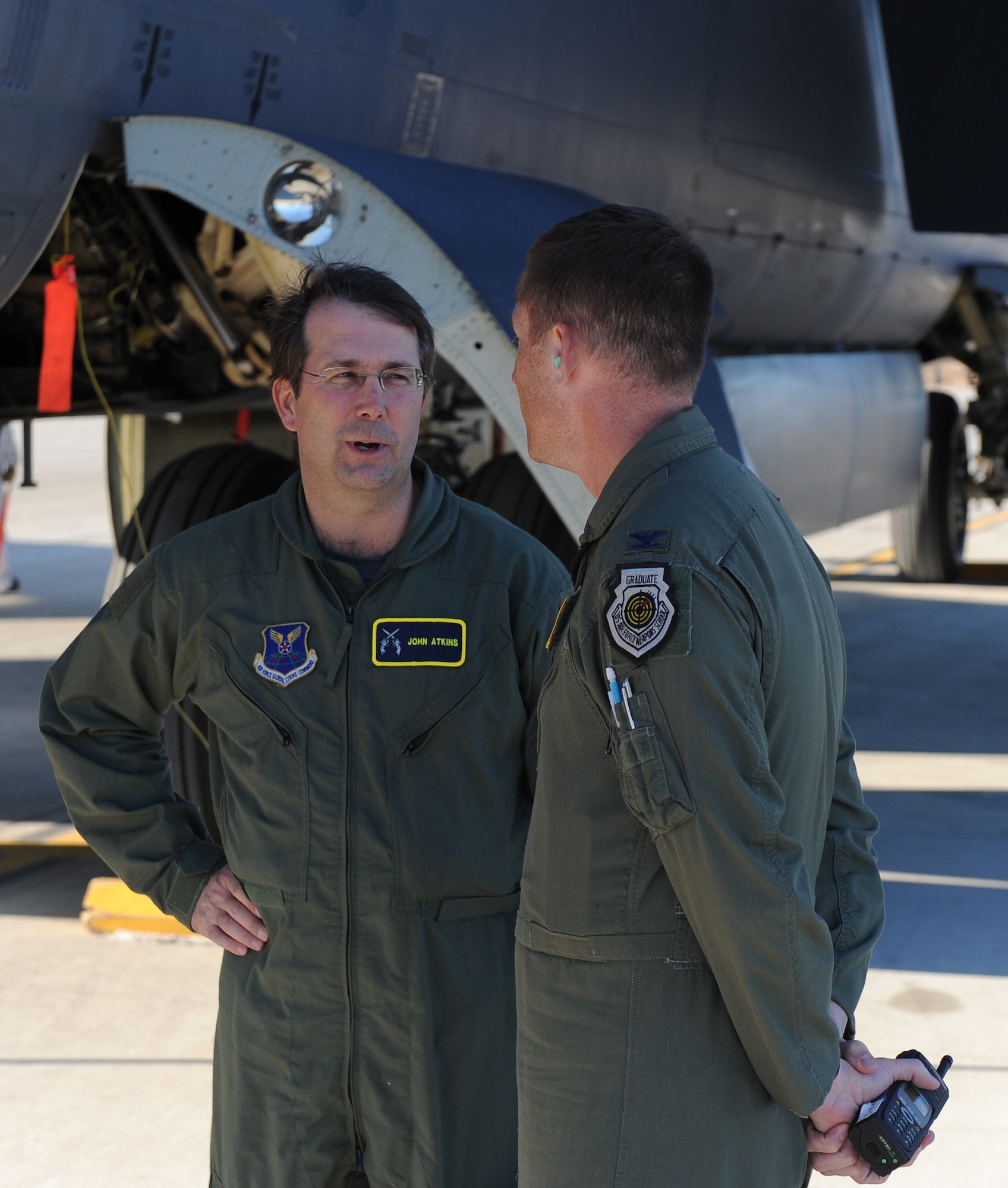 John Atkins, Shreveport-Bossier Military Affairs Council president, describes his experience to Col. Alexis Mezynski, 2nd Bomb Wing vice commander, after his B-52H Stratofortress orientation flight on Barksdale Air Force Base, La., Nov. 28. The purpose of the flight was to provide a deeper understanding of the full spectrum of  Air Force Global Strike Command and an appreciation for the quality Airmen and civilians who protect the nation every day. (U.S. Air Force photo Senior Airman Micaiah Anthony)