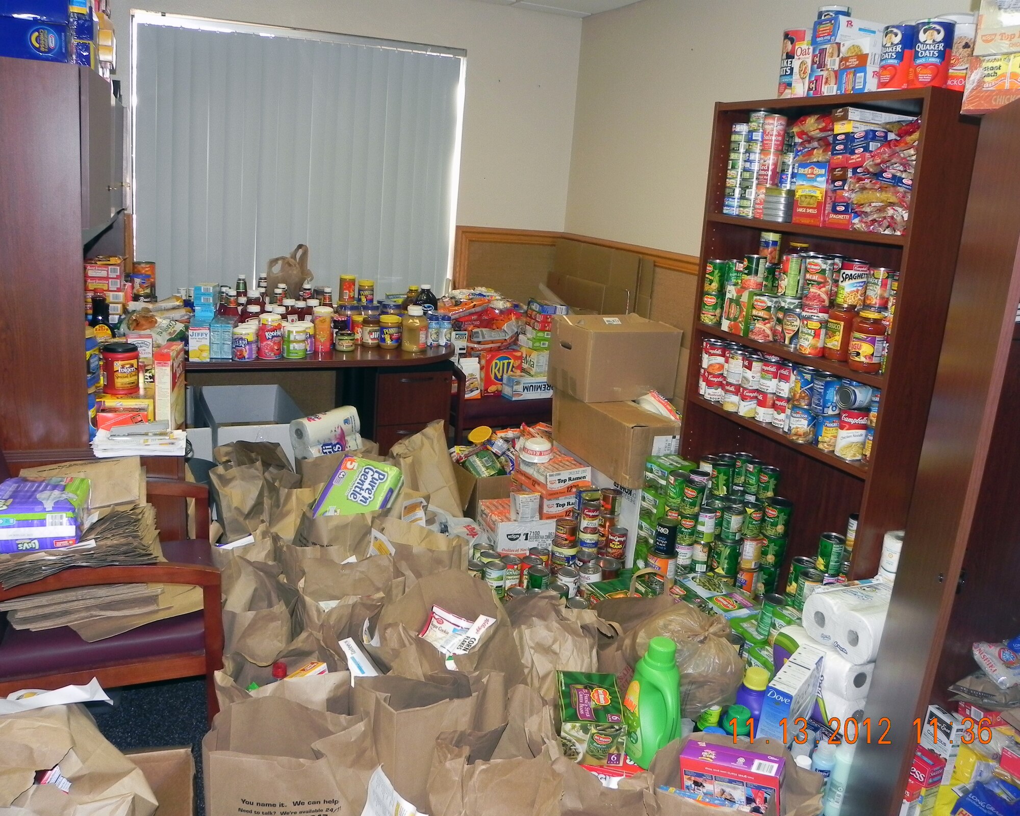Food is stored at the base chapel after being collected from the commissary for D-M Airmen families in need. Volunteers collected approximately 5,000 pounds of canned goods. (Courtesy photo)