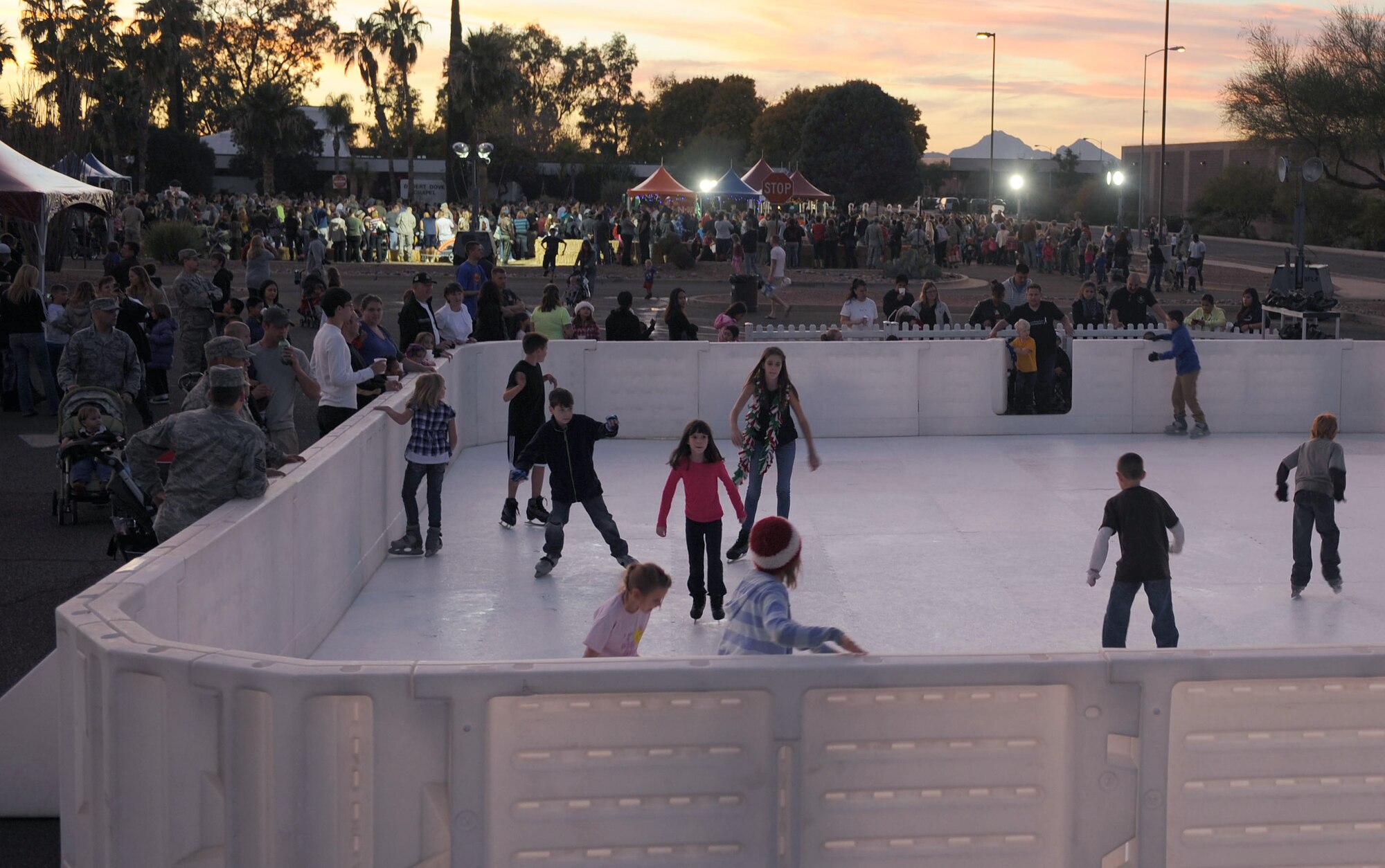 Children from around the base ice skate at A Starry Snowy Southwest Night event in the chapel parking lot on Davis-Monthan Air Force Base, Ariz., Nov. 27. There were approximately 2,800 individuals that came out to enjoy the festivities. (U.S. Air Force photo by Senior Airman Brittany Dowdle)