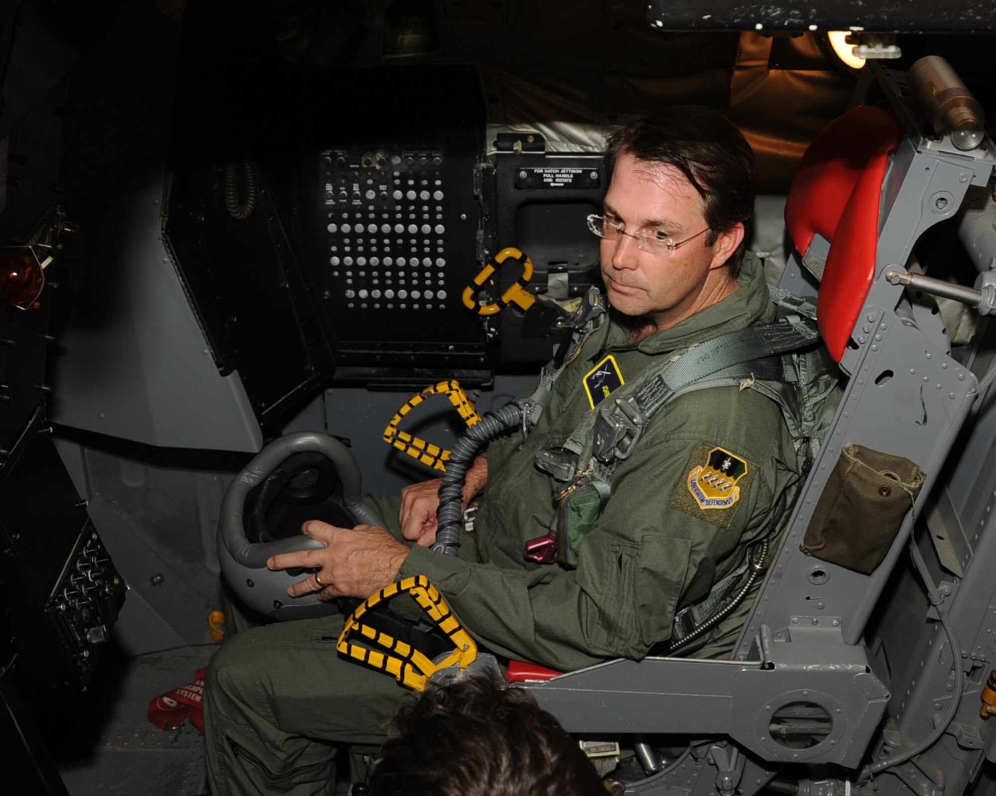 John Atkins, Shreveport-Bossier Military Affairs Council president, receives egress instructions in a simulated cockpit of a B-52H Stratofortress as part of an orientation flight on Barksdale Air Force Base, La., Nov. 27. The purpose of the flight was to give him a deeper understanding of the full spectrum of Air Force Global Strike Command mission and an appreciation for the quality Airmen and civilians who protect the nation every day. (U.S. Air Force photo/Senior Airman Sean Martin)
