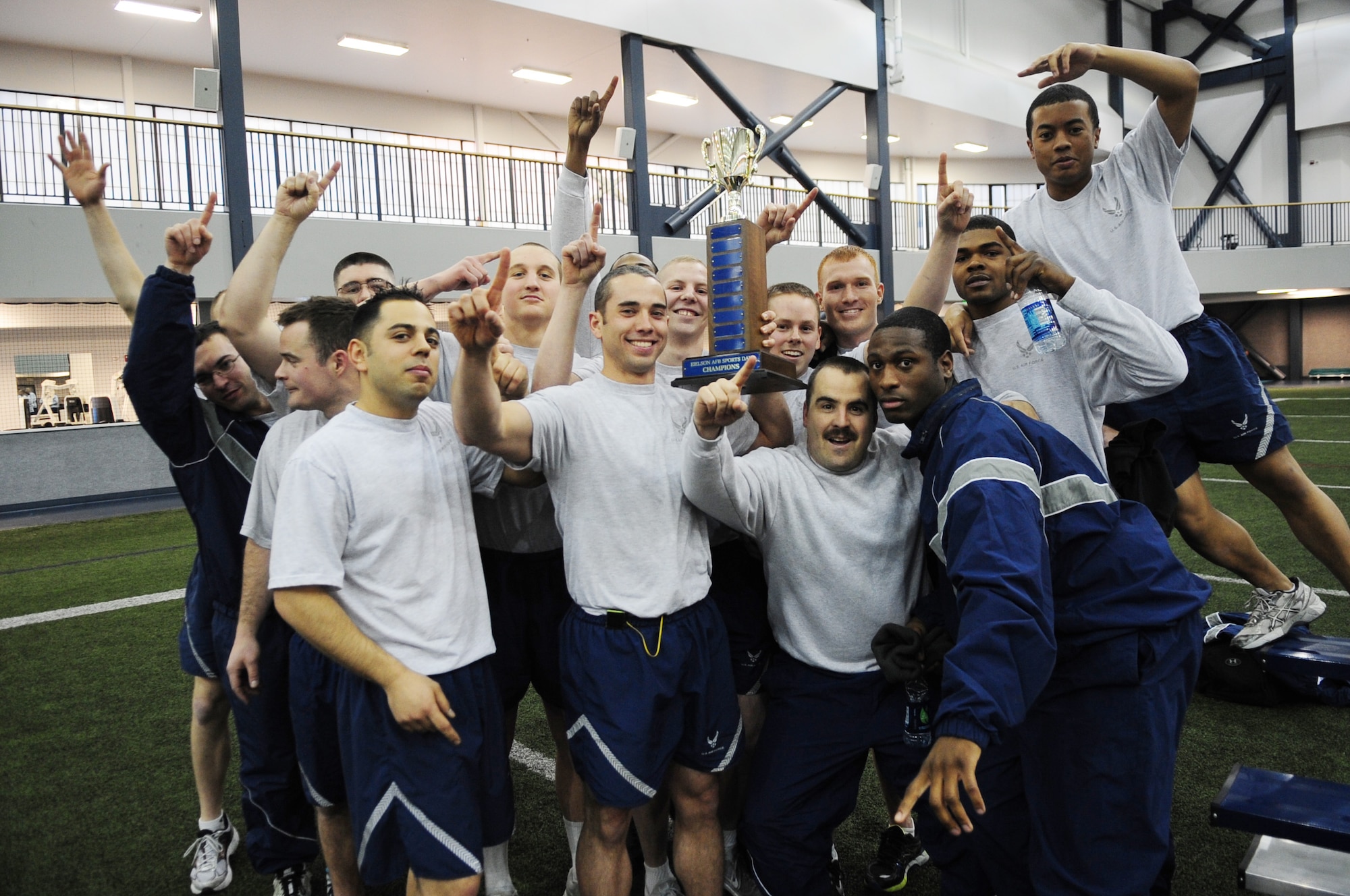 Members of the 354th Civil Engineer Squadron hold up the first place trophy as the champions of Sports Day Nov. 21, 2012, Eielson Air Force Base, Alaska. The 354th CES took the trophy after winning the most first place positions throughout the competition. (U.S. Air Force photo/Staff Sgt. Jim Araos)