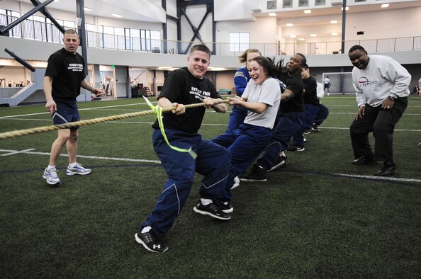 Members of the 354th Force Support Squadron compete in a tug-of-war competition during Sports Day Nov. 21, 2012, Eielson Air Force Base, Alaska. Sports Day was held to build team work, camaraderie and friendly competition within teams and units on base. (U.S. Air Force photo/Staff Sgt. Jim Araos)