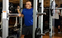 Airman 1st Class Brandon Stout, 28th Civil Engineer Squadron Fire Department driver operator, shoulders 135 pounds while warming up for a squat during Ellsworth's Strongest in the Bellamy Fitness Center at Ellsworth Air Force Base, S.D., Nov. 16, 2012. To avoid damage to muscles and other areas of the body, participants were given 15 minutes to warm up before the competition began. (U.S. Air Force photo by Airman Ashley J. Woolridge/Released)