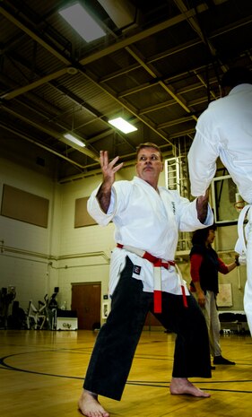 Tim Boykin, Space and Naval Warfare Systems operations research analyst and retired Navy commander, trains service members and civilians in martial arts Nov. 26, 2012, at the Joint Base Charleston – Air Base fitness center. Boykin is an 8th degree black belt in Isshin-ryu and has crafted his skill in martial arts for more than 40 years. (U.S. Air Force Photo / Airman 1st Class Tom Brading)