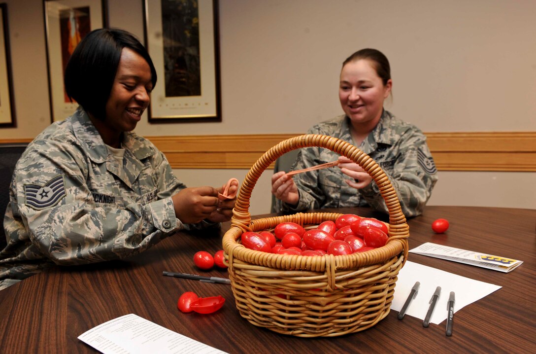 Tech. Sgts. Latasha McKnight (left), 28th Medical Operations Squadron clinical dentistry NCO in charge, and Sarah Robson, 28th Civil Engineer Squadron geo-spatial information systems and training NCO in charge, mold silly putty during a Life Lessons With Silly Putty class conducted by David Brinkworth, 28th Force Support Squadron Airman and Family Readiness Center community readiness consultant, at the Rushmore Center at Ellsworth Air Force Base, S.D., Nov. 15, 2012. The class emphasizes building resiliency and coping skills by molding life issues into something positive. (U.S. Air Force photo by Airman 1st Class Anania Tekurio/Released)