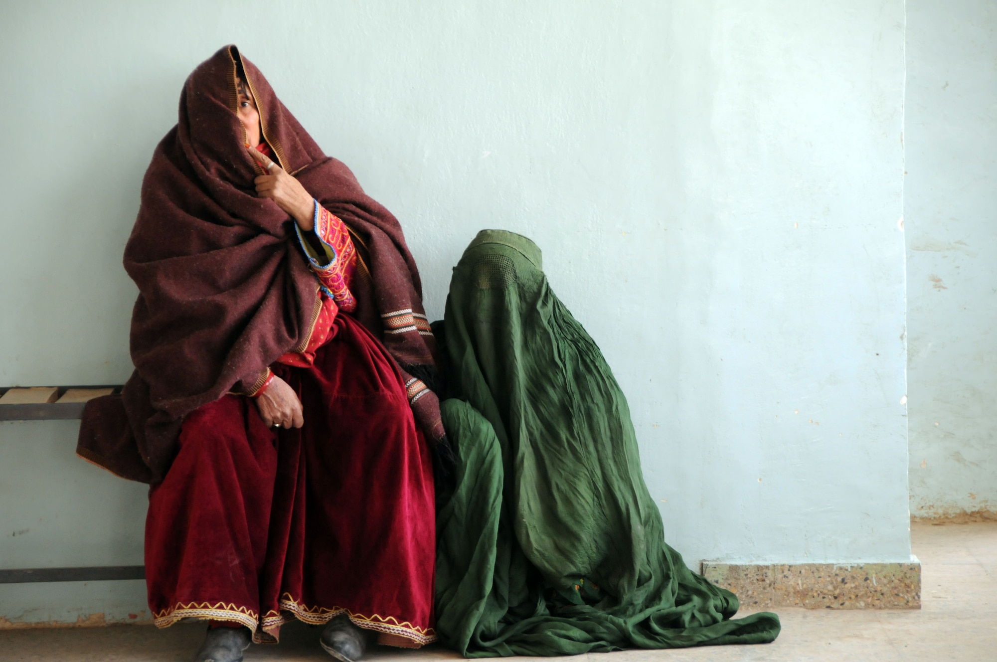 Women sit in the waiting area outside the female outpatient department of the Moqur Comprehensive Health Clinic in Moqur, Afghanistan on Dec. 17, 2009.  Medical staff from Provincial Reconstruction Team Ghazni visited the clinic to perform a comprehensive assessment of the clinics capabilities and needs.  (U.S. Air Force/Tech Sgt. Rebecca F. Corey)