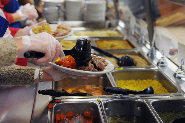 Wing leaders served a variety of foods for a Thanksgiving feast including turkey, roast beef and corn at the Southern Eagle Dining Facility on Seymour Johnson Air Force Base, N.C., Nov. 22, 2012. Members of Team Seymour were welcome to attend the gathering with loved ones and guests. (U.S. Air Force photo/Airman 1st Class John Nieves Camacho/Released)
