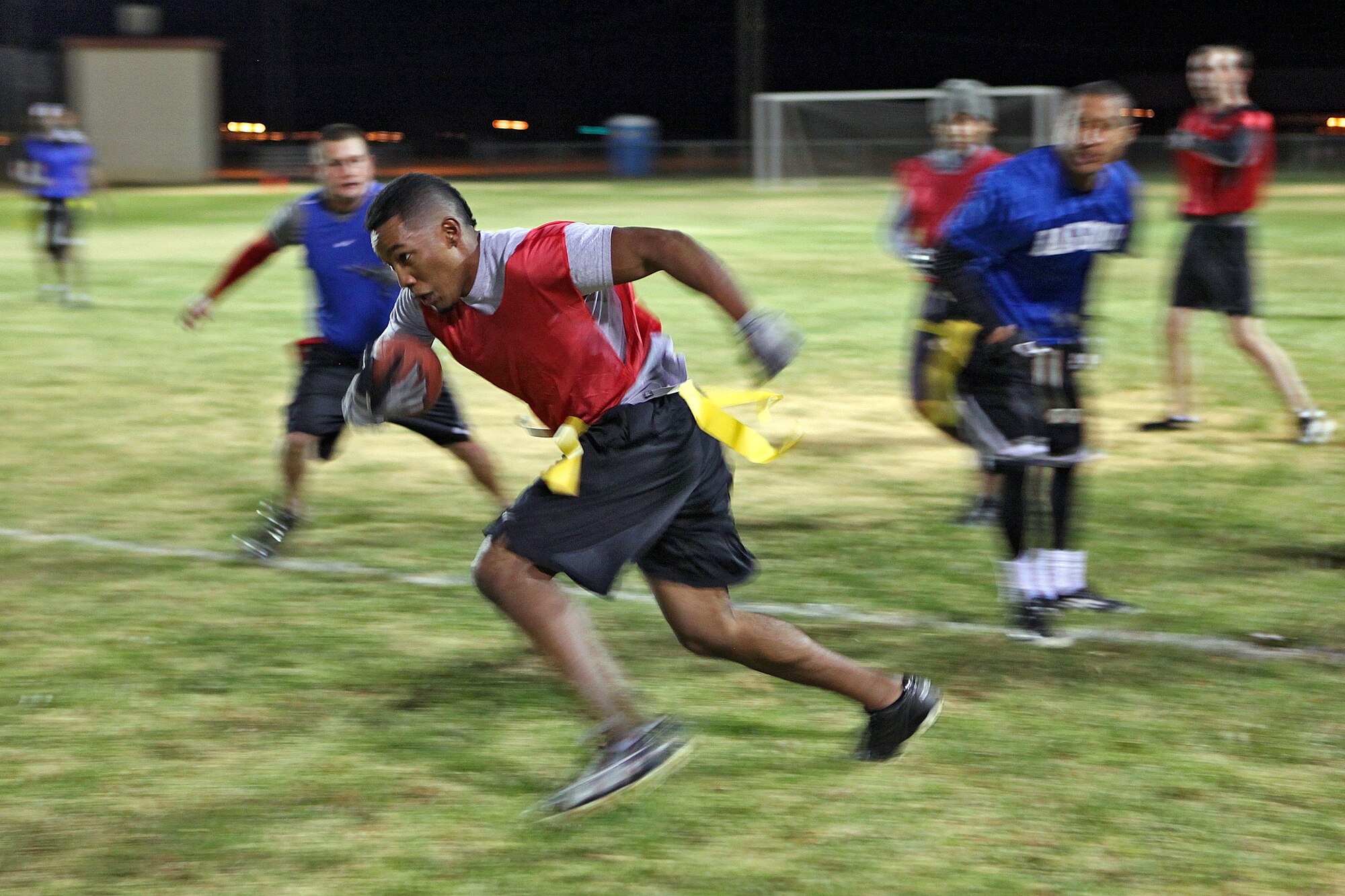 Nick Holloway, 419th Flight Test Squadron, attempts to run in for a second down for the 412th Electronic Warfare team during the second half of an intramural football playoff game against the 412th Medical Group Nov. 27, 2012 at Wings Field. The 412th MDG defeated the 412th EWG team 40-12. (U.S. Air Force photo by Jet Fabara)