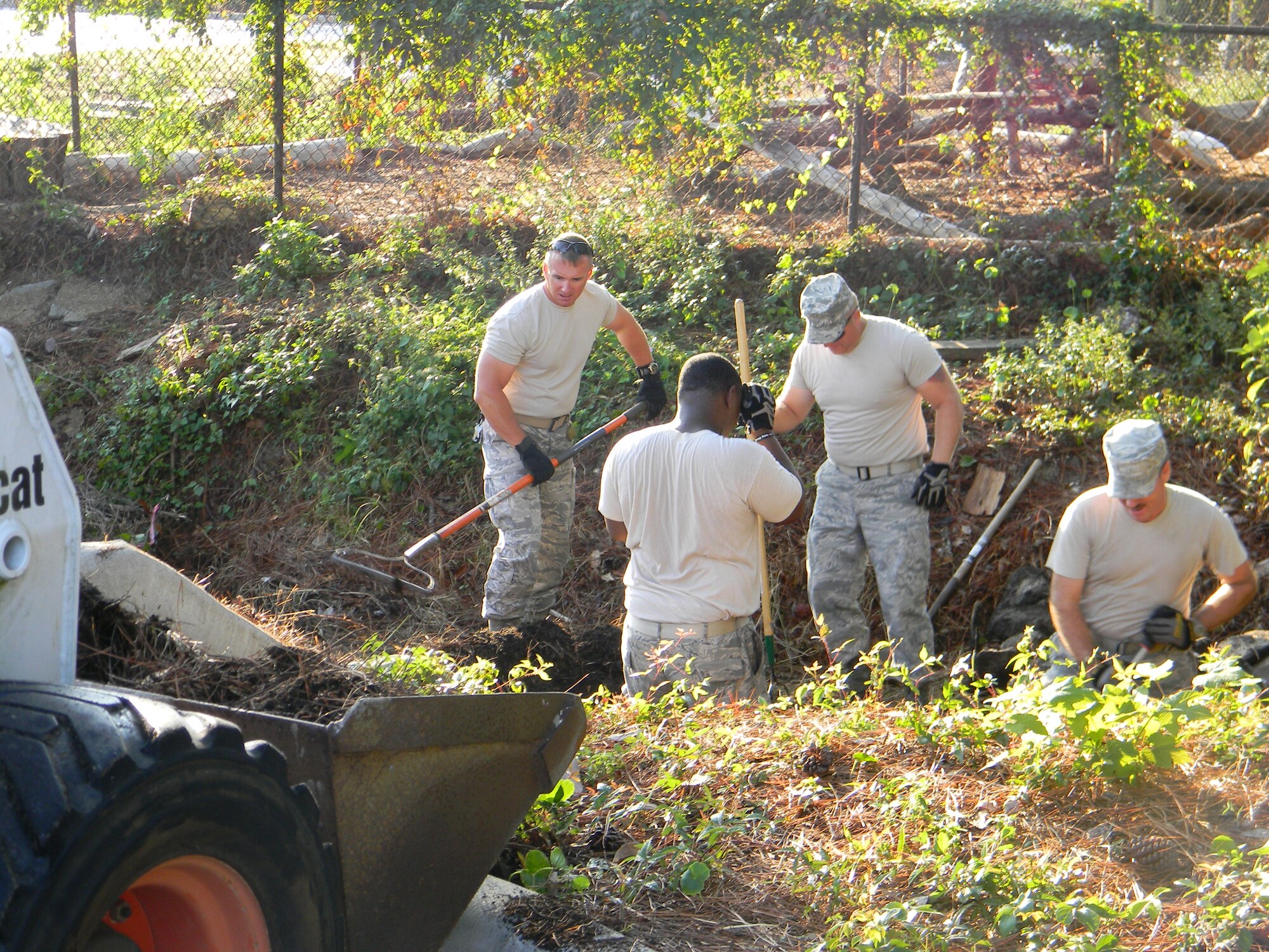 Airmen use heavy machinery to help strengthen the stream and surrounding ecosystem for the Hurlburt Field Youth Center Wetland Stream Project at Hurlburt Field, Fla.  (Courtesy photo by Catherine Goss)