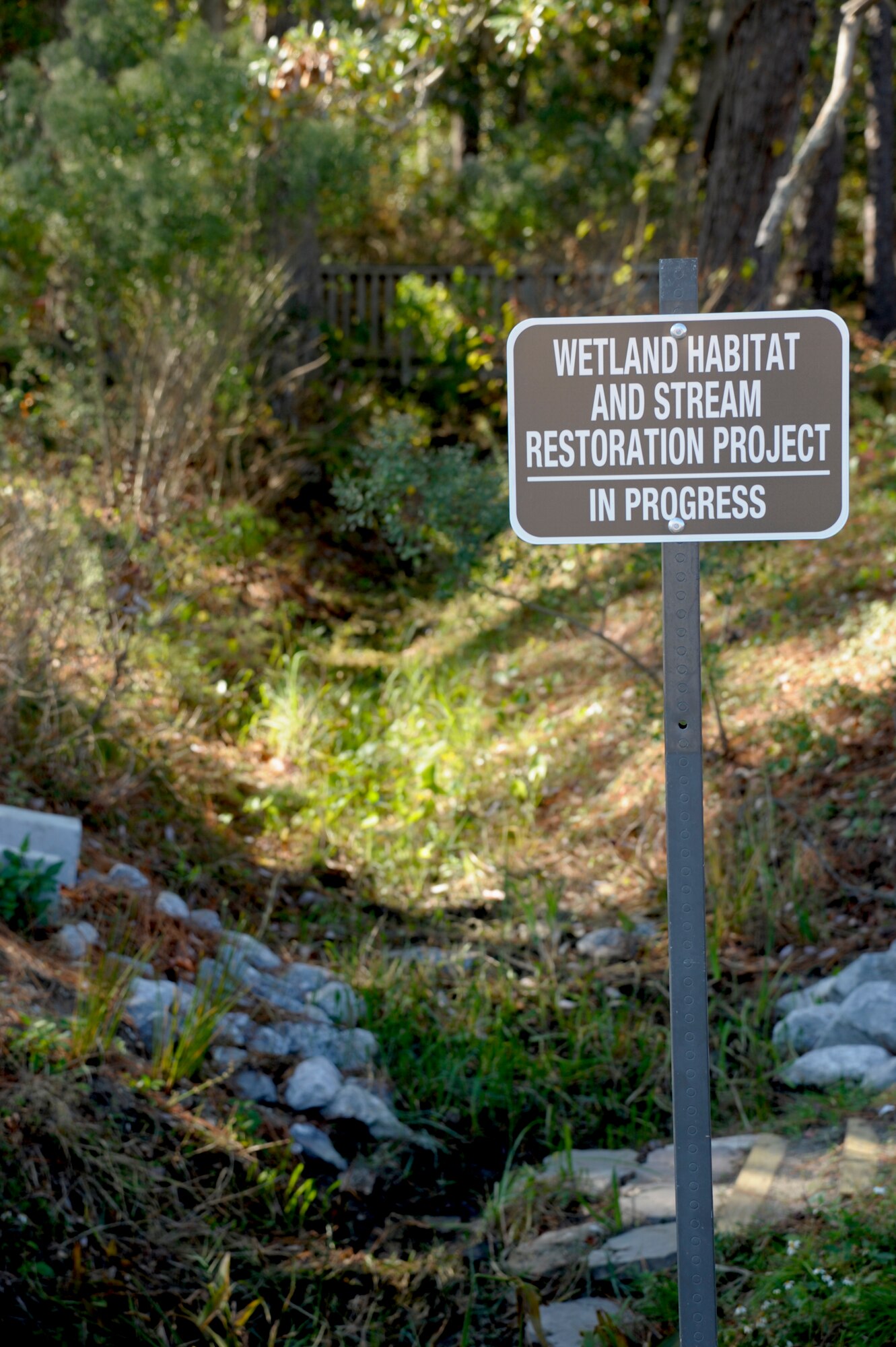 A sign is posted to indicate the Hurlburt Field Youth Center Wetland Stream Project, at Hurlburt Field, Fla., Nov. 28, 2012.  The purpose of the ongoing project is to restore streams to strengthen the ecosystem for plants and wildlife, and in turn, yield educational, volunteer and recreational activities for children and Airmen of Hurlburt Field.  (U.S. Air Force Photo / Airman 1st Class Benjamin D. Kim)
