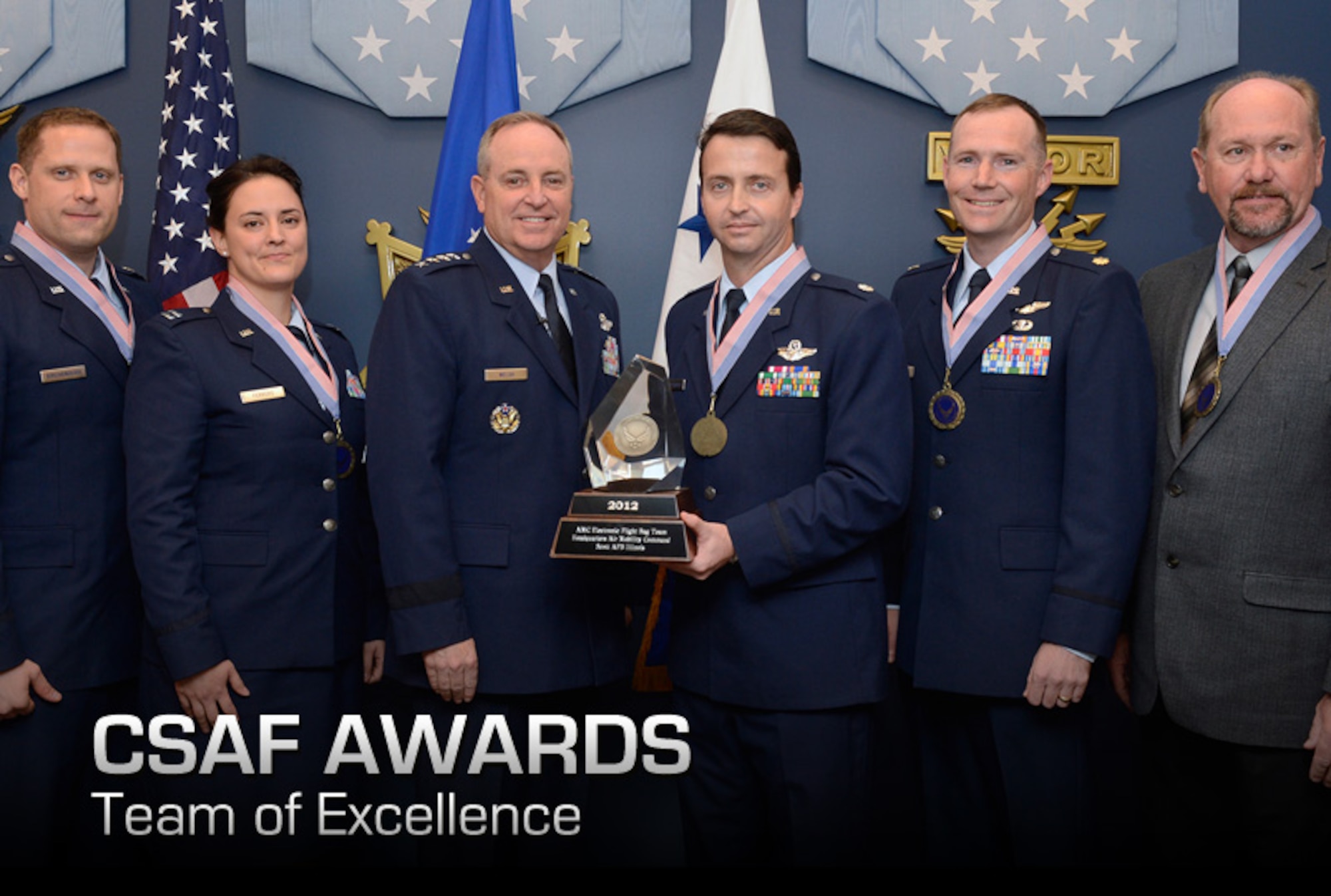 Members of the winning team of the 2012 Chief of Staff Team Excellence Award is the AMC Electronic Flight Bag Team From Scott Air Force Base, Ill., are congratulated by Air Force Chief of Staff Gen. Mark A. Welsh III in a Pentagon ceremony on Nov. 27, 2012.  (U.S. Air Force photo/Scott M. Ash)