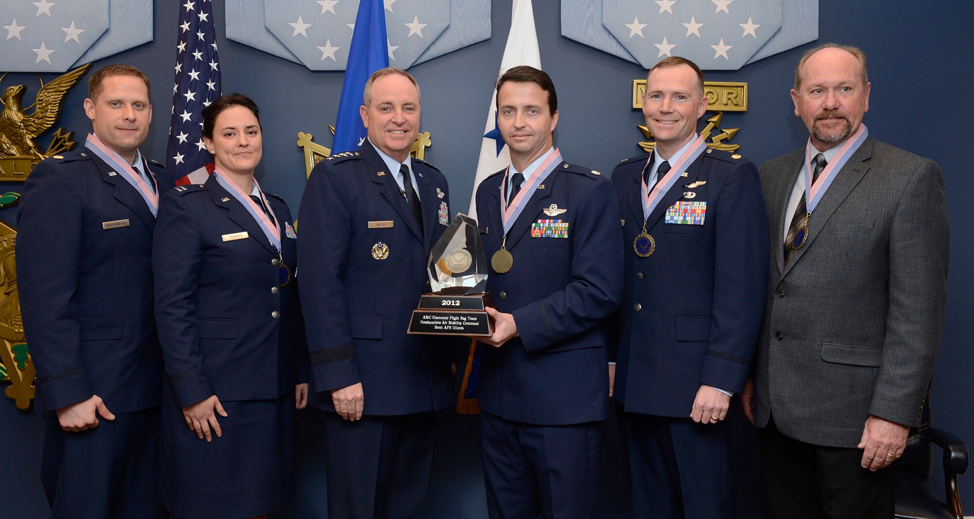 Members of the winning team of the 2012 Chief of Staff Team Excellence Award is the AMC Electronic Flight Bag Team From Scott Air Force Base, Ill., are congratulated by Air Force Chief of Staff Gen. Mark A. Welsh III in a Pentagon ceremony on Nov. 27, 2012.  (U.S. Air Force photo/Scott M. Ash)