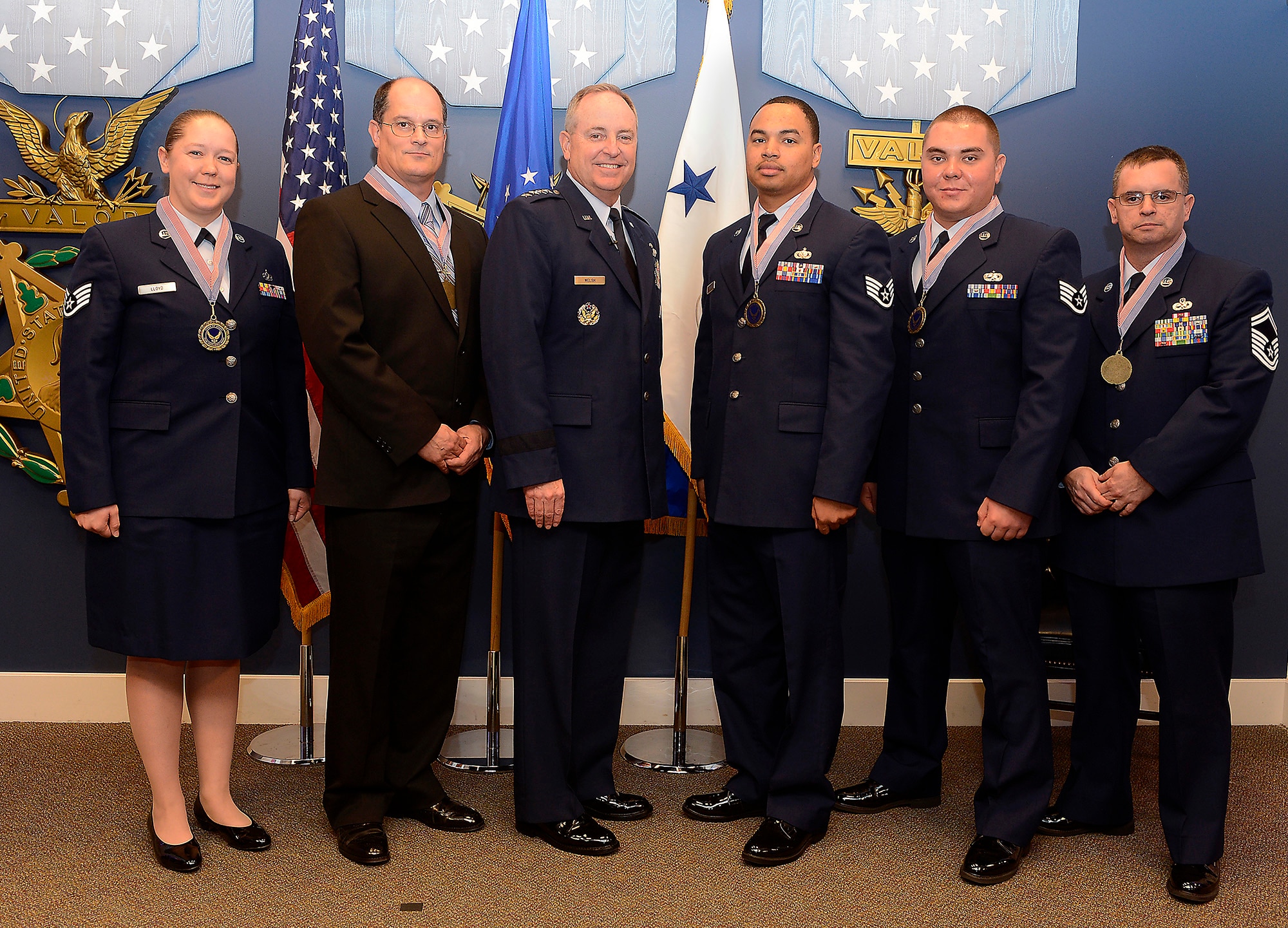 Members of the second runner-up of the 2012 Chief of Staff Team Excellence Award, the B-2 window Change Continuous Process Improvement Team from Whiteman Air Force Base, Mo., are congratulated by Air Force Chief of Staff Gen. Mark A. Welsh III in a Pentagon ceremony on Nov. 27, 2012.  (U.S. Air Force photo/Scott M. Ash)

