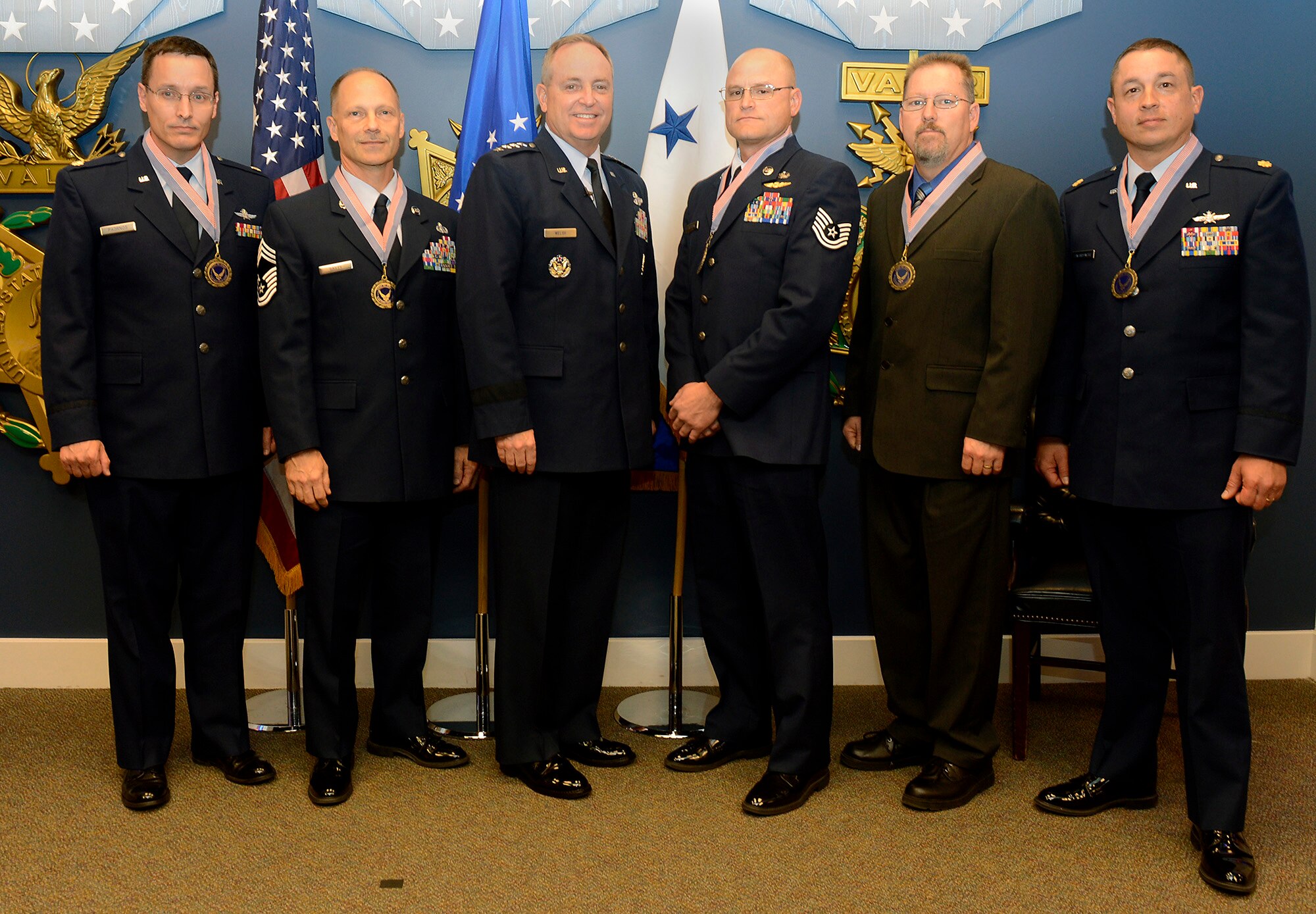 Members of the first runner-up of the 2012 Chief of Staff Team Excellence Award, the BRAC AFRL Radar Relocation Project Management Team from Stewart Air National Guard Base, N.Y., are congratulated by Air Force Chief of Staff Gen. Mark A. Welsh III in a Pentagon ceremony on Nov. 27, 2012.  (U.S. Air Force photo/Scott M. Ash)

