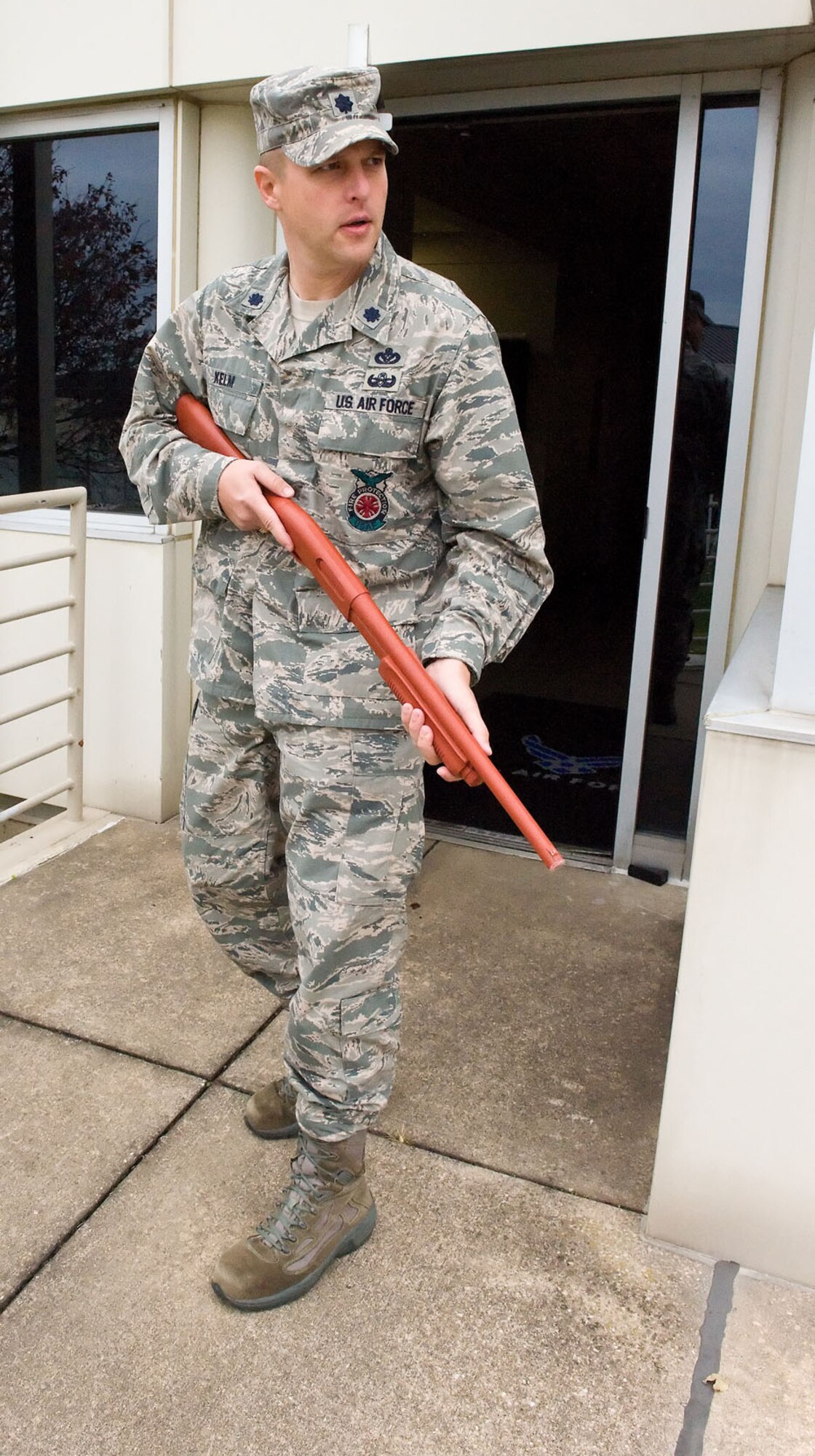 Lt. Col. Charles Kelm, commander of the 436th Civil Engineer Squadron, plays the role of an active shooter during the Major Accident Response Exercise Nov. 15, 2012, at Dover Air Force Base, Del., at building 600. The MARE tested Team Dover's ability to respond to simulated incidents on base. (U.S. Air Force photo by Roland Balik)