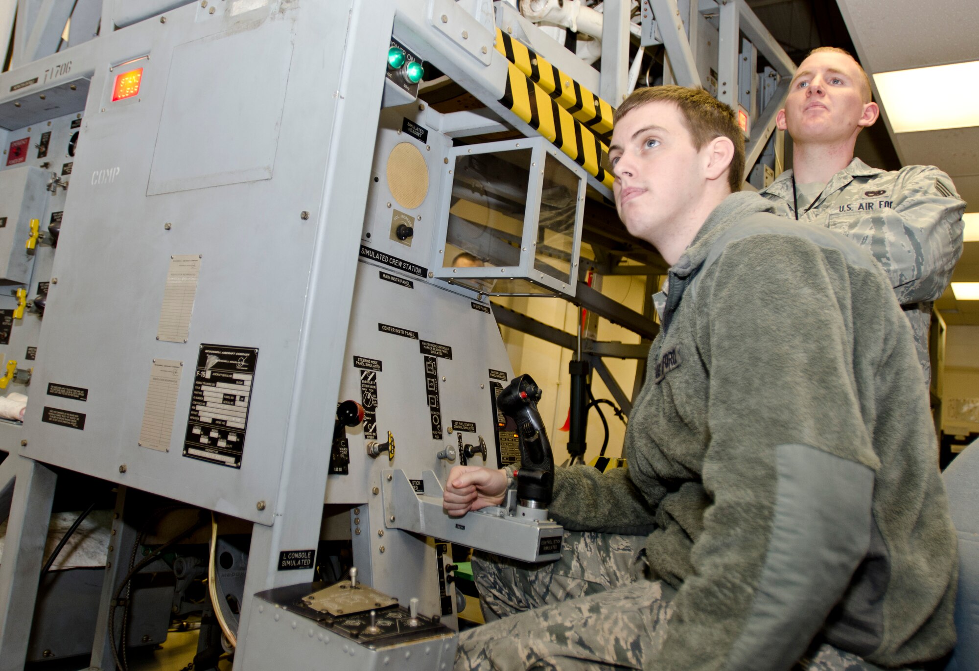ROYAL AIR FORCE LAKENHEATH, England - Airman 1st Class Brandon Marvel (front), 748th Aircraft Maintenance Squadron tactical aircraft maintenance apprentice and native of Taylor, Mich., and Senior Airman Joseph Schlotthauer, 493rd Aircraft Maintenance Unit tactical aircraft maintenance journeyman and native of Lancaster, Pa., watch a presentation during an F-15 hydraulics course Nov. 27, 2012. Detachment 16 offers 61 courses at RAF Lakenheath that are designed to provide aircraft maintainers with the necessary knowledge and skills to keep the Liberty Wing's F-15C Eagles, F-15E Strike Eagles and HH-60G Pave Hawks mission ready. (U.S. Air Force photo by Staff Sgt. Stephen Linch)