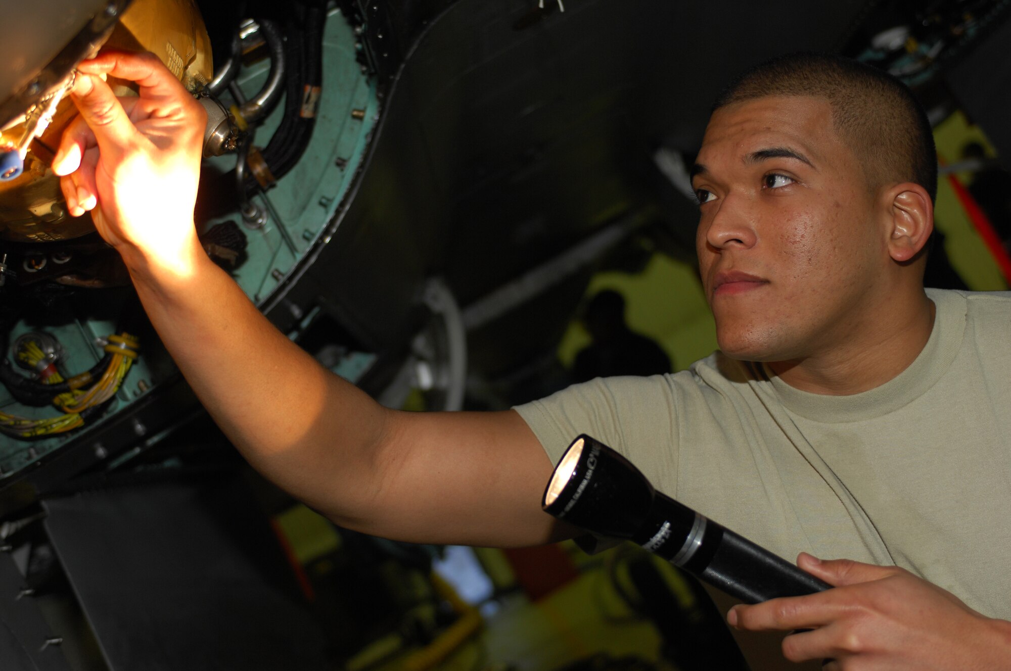ROYAL AIR FORCE LAKENHEATH, England -- Airman 1st Class Edgar Diaz, 48th Component Maintenance Squadron electrical and environmental systems journeyman, inspects an F-15C Eagle Nov. 27, 2012. Edgar was nominated for a Liberty Spotlight because he displays the core value of "Excellence in All We Do." (U.S. Air Force photo by Airman 1st Class Dana Butler)