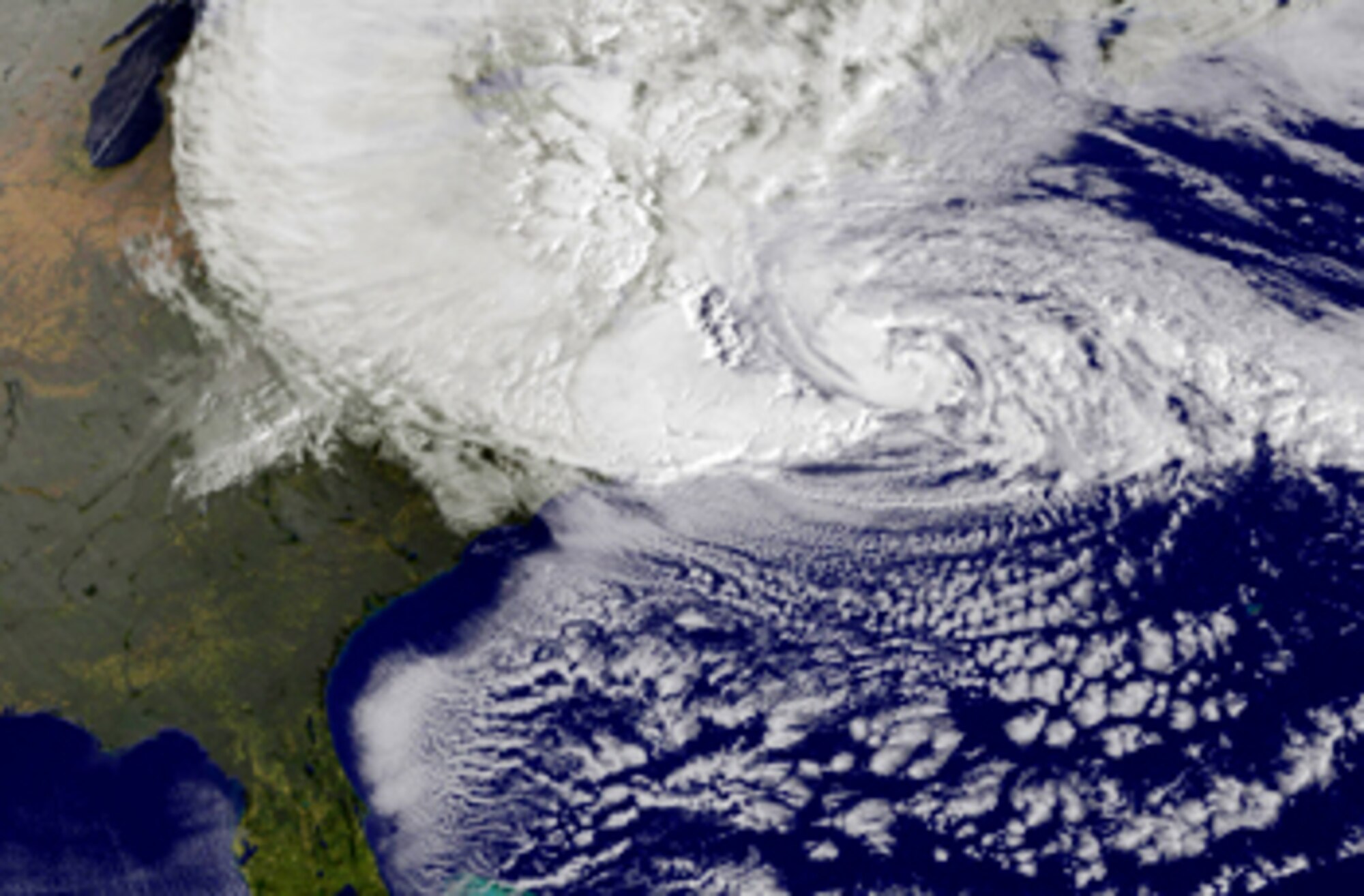 Photo shows satellite image of Hurricane Sandy making landfall over the Northeastern United States.