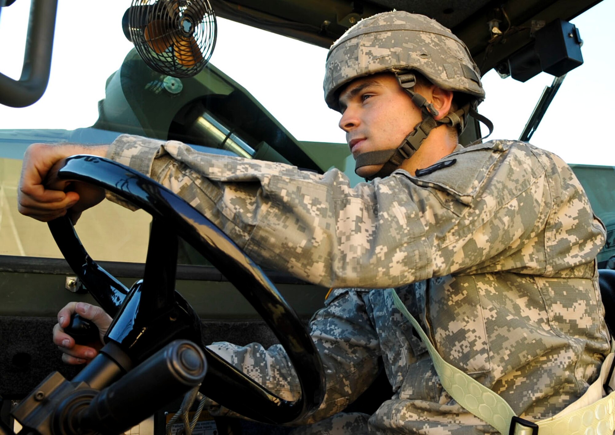 U.S. Army Spc. Michael Visser, 690th Rapid Port Opening Element cargo specialist, operates his forklift at the motor pool at Fort Eustis, Va., Nov. 26, 2012. Visser said finding faith was the cornerstone of his career in the Army and helps him help other people in the process. (U.S. Air Force photo by Staff Sgt. Wesley Farnsworth/Released)