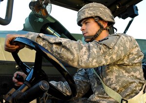 U.S. Army Spc. Michael Visser, 690th Rapid Port Opening Element cargo specialist, operates his forklift at the motor pool at Fort Eustis, Va., Nov. 26, 2012. Visser said finding faith was the cornerstone of his career in the Army and helps him help other people in the process. (U.S. Air Force photo by Staff Sgt. Wesley Farnsworth/Released)