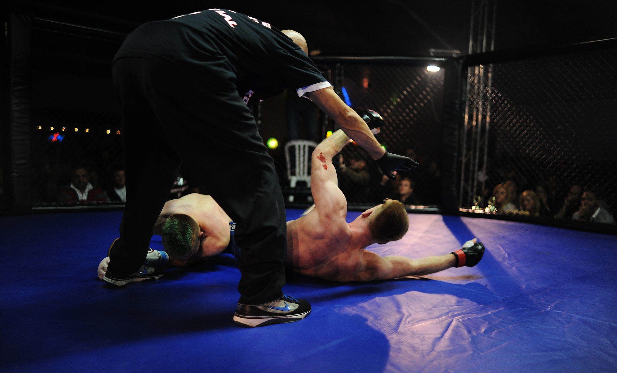 BAUMHOLDER, Germany – Airman 1st Class Sean Whitaker, right, Spangdahlem mixed martial arts team member, releases his opponent as the referee calls the match Nov. 17, 2012, at Kombat Komplett 7 in Baumholder. Whitaker won the match at 00:01:03 into the second round. Whitaker started training in martial arts in 2010. Whitaker, a Pittsburgh native, is an intelligence analyst with the 480th Fighter Squadron at Spangdahlem Air Base. (U.S. Air Force photo by Senior Airman Natasha Stannard/Released)