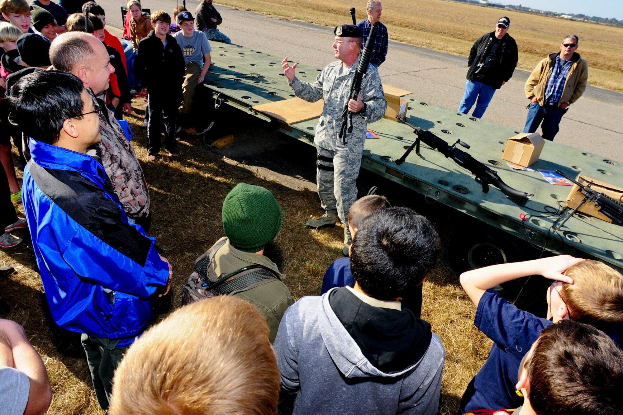 Senior Master Sgt. Ralph Guyton, 169th Security Forces Squadron, demonstrates the proper use of fire arms to boy scouts of America at McEntire Joint National Guard Base, S.C. , November 3, 2012. Guyton demonstration was to assist the boy scouts in earning merit badge. The base hosted the Indian Waters Council Boy Scouts Camporee and supported the event with Army and Air National Guard static displays, recruiters and demonstration from medical, security, emergency management and fire department. (SCANG photo by Staff Sgt. Jorge Intriago/Released) 