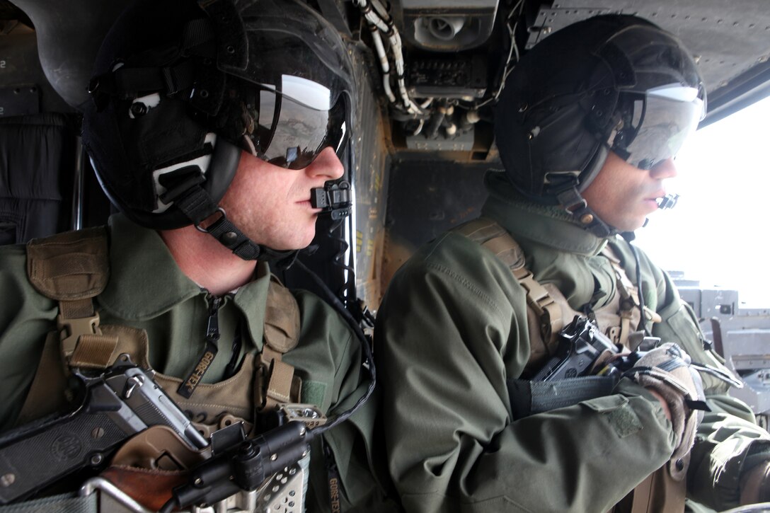 U.S. Marine Corps Cpl. Patrick R. White, left, and Staff Sgt. Jared G. Tape conduct Operation Aero Hunter with other Regional Command elements in Helmand province, Afghanistan, Nov. 27, 2012. The air interdiction force was used as a quick reaction force in support of counter-insurgency operations in Southern Helmand.