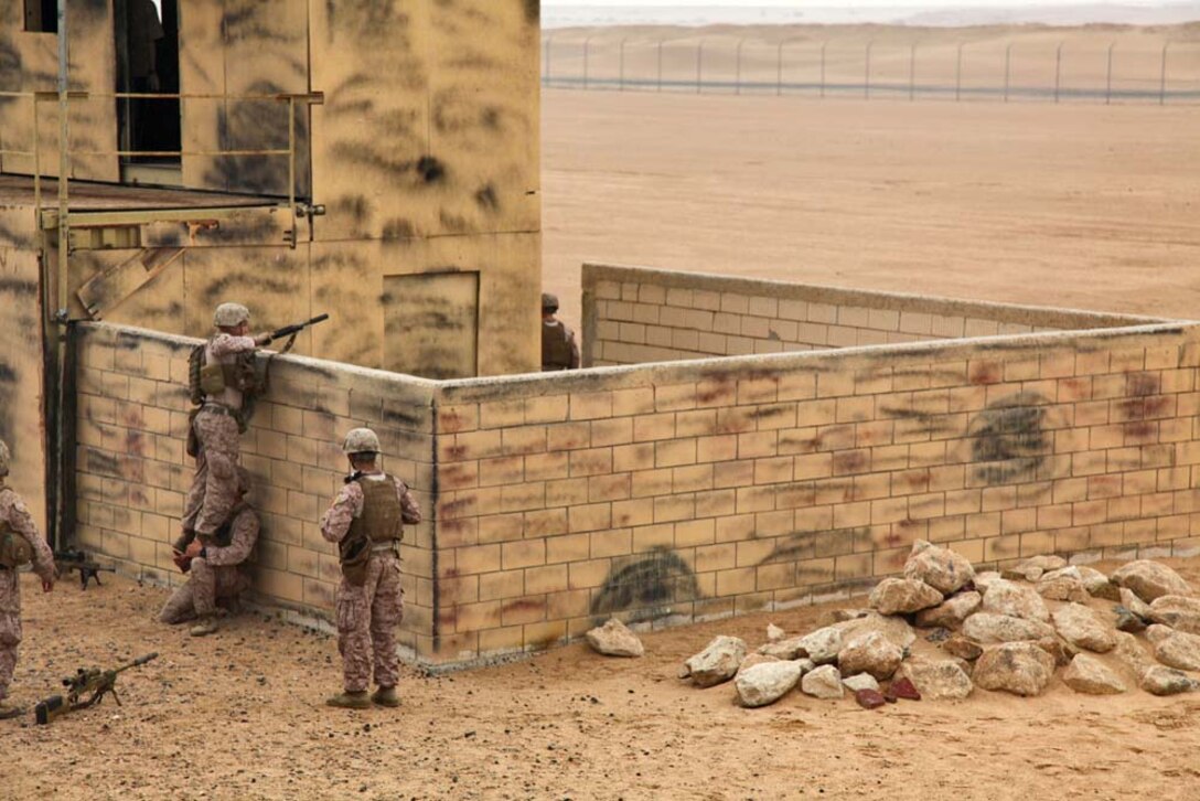 U.S. Marines assigned to Sniper Platoon, Weapons Company, Battalion Landing Team 3/5, 15th Marine Expeditionary Unit practice Military Operations on Urban Terrain at Camp Buehring, Kuwait, Nov. 23. The 15th MEU is deployed with the Peleliu Amphibious Ready Group as a U.S. Central Command theater reserve force, providing support for maritime security operations and theater security cooperation efforts in the U.S. 5th Fleet area of responsibility. (U.S. Marine Corps photo by Cpl. Timothy R. Childers/Released)

