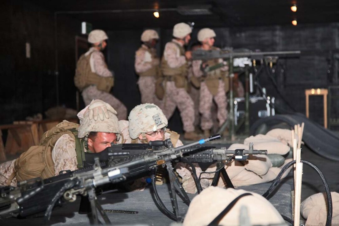 U.S. Marines assigned to Battalion Landing Team 3/5, 15th Marine Expeditionary Unit (MEU) train with different weapons systems at an Indoor Simulated Marksmanship Trainer (ISMT) at Camp Buehring, Kuwait, Nov. 23. The 15th MEU is deployed with the Peleliu Amphibious Ready Group as a U.S. Central Command theater reserve force, providing support for maritime security operations and theater security cooperation efforts in the U.S. 5th Fleet area of responsibility. (U.S. Marine Corps photo by Cpl. Timothy R. Childers/Released)
