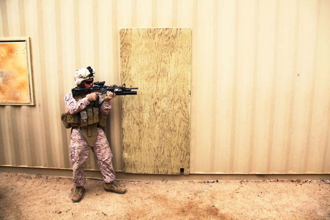 A U.S. Marine assigned to Light Armored Reconnaissance Platoon, Weapons Company, Battalion Landing Team 3/5, 15th Marine Expeditionary Unit provides security while practicing Military Operations on Urban Terrain at Camp Buehring, Kuwait, , Nov. 23. The 15th MEU is deployed with the Peleliu Amphibious Ready Group as a U.S. Central Command theater reserve force, providing support for maritime security operations and theater security cooperation efforts in the U.S. 5th Fleet area of responsibility. (U.S. Marine Corps photo by Cpl. Timothy R. Childers/Released)
