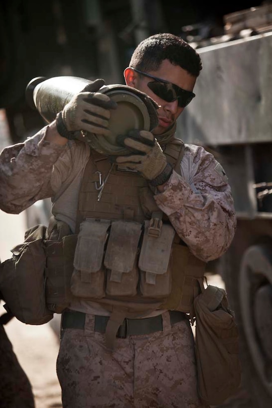 U.S. Marine Corps Lance Cpl. Alejandro A. Santana with Bravo Battery, 1st Battalion, 11th Marine Regiment, 15th Marine Expeditionary Unit, carries ammunition for the M777A2 Lightweight Howitzer during Eager Mace 13, aboard Forward Operating Base Sword, Kuwait November 14, 2012. The purpose of the exercise is to expand levels of cooperation, maritime capabilities, as well as promote long-term regional stability and interoperability between U.S. forces and regional partners. (U.S. Marine Corps photo by Cpl. Bobby J. Gonzalez/Not Reviewed)