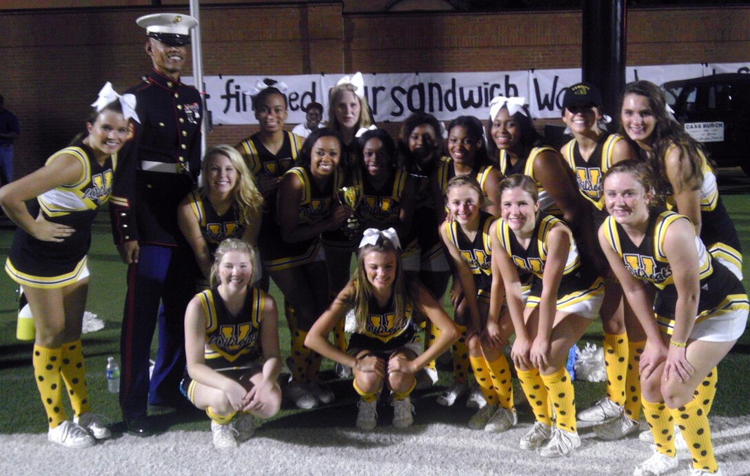 The cheerleaders from the Valdosta Wildcats accept the trophy for their school performing the most pullups during the Lowndes VS Valdosta Great American Rivalry Series game, held Oct. 12th in Valdosta, Ga.