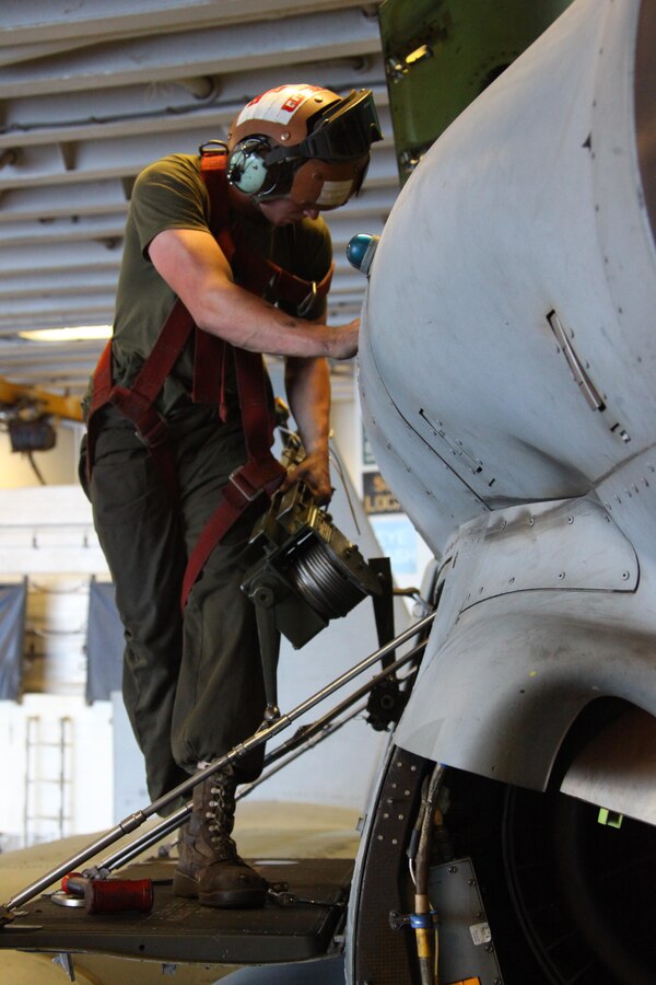 USS IWO JIMA, Mediterranean Sea (Nov. 27, 2012) - A Marine with Marine Medium Tiltrotor Squadron 261 (Reinforced), 24th Marine Expeditionary Unit, disconnects his harness from an MV-22B Osprey after finishing routine maintenance procedures aboard USS Iwo Jima, Nov. 27, 2012. The 24th Marine Expeditionary Unit is deployed with the Iwo Jima Amphibious Ready Group in the 6th Fleet area of responsibility serving as an expeditionary crisis response force capable of a variety of missions, from full-scale combat to evacuations and humanitarian assistance. Since deploying in March, they have supported a variety of missions in the U.S. Central, Africa and European Commands, assisted the Navy in safeguarding sea lanes, and conducted various bilateral and unilateral training events in several countries in the Middle East and Africa. (U.S. Marine Corps photo by Lance Cpl. Tucker S. Wolf/Released)