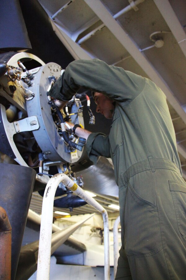 USS IWO JIMA, Mediterranean Sea (Nov. 27, 2012) - Cpl. Matthew Bellwood, an Oxford, Maine, native with Marine Medium Tiltrotor Squadron 261 (Reinforced), 24th Marine Expeditionary Unit, conducts maintenance on a turbine engine of an MV-22B Osprey aboard USS Iwo Jima, Nov. 27, 2012. The 24th Marine Expeditionary Unit is deployed with the Iwo Jima Amphibious Ready Group in the 6th Fleet area of responsibility serving as an expeditionary crisis response force capable of a variety of missions, from full-scale combat to evacuations and humanitarian assistance. Since deploying in March, they have supported a variety of missions in the U.S. Central, Africa and European Commands, assisted the Navy in safeguarding sea lanes, and conducted various bilateral and unilateral training events in several countries in the Middle East and Africa. (U.S. Marine Corps photo by Lance Cpl. Tucker S. Wolf/Released)