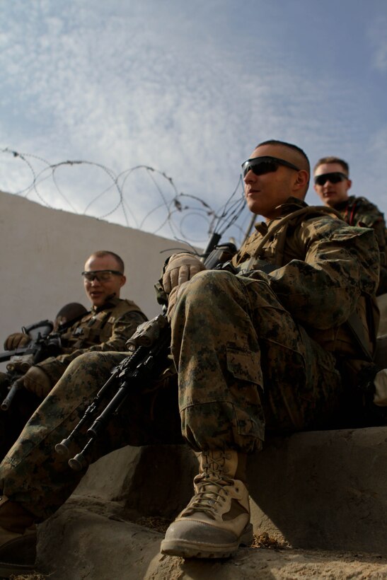 Lance Cpl. Dallin Jaramillo, rifleman, Lima Company, 3rd Battalion, 9th Marine Regiment, Regimental Combat Team 7, takes a break at an Afghan Local Police station, Nov. 27, 2012. The Marines drank chai tea with the ALP and patrolled with the Afghan National Army.
