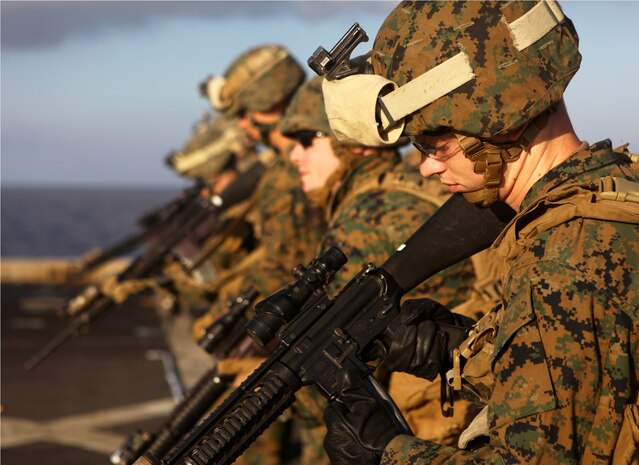 USS NEW YORK, Mediterranean Sea (Nov. 26, 2012) – Marines with India Battery, the artillery unit attached to Battalion Landing Team 1st Battalion, 2nd Marine Regiment, 24th Marine Expeditionary Unit, reload their weapons during combat marksmanship training on the flight deck of the USS New York, Nov. 26, 2012. The 24th Marine Expeditionary Unit is deployed with the Iwo Jima Amphibious Ready Group in the 6th Fleet area of responsibility, serving as an expeditionary crisis response force capable of a variety of missions from full-scale combat to evacuations and humanitarian assistance. (Marine Corps photo by Cpl. Michael Petersheim)

