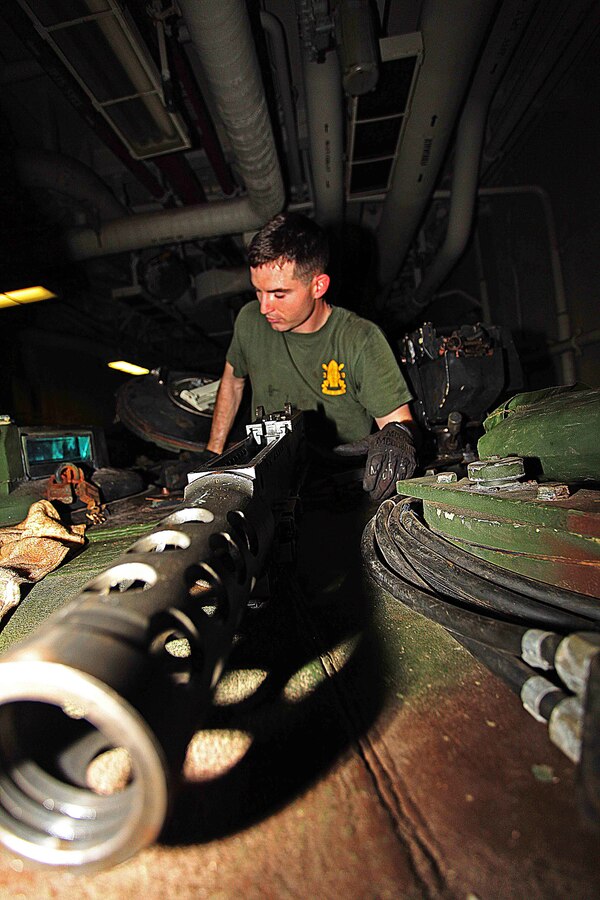USS IWO JIMA, Mediterranean Sea (Nov. 26, 2012) - Sgt. Hunter Pierce, a Westchester, N.Y., native with Weapons Company, Battalion Landing Team 1st Battalion, 2nd Marine Regiment, 24th Marine Expeditionary Unit, conducts routine maintenance on an M1A1 Abrams tank aboard USS Iwo Jima, Nov. 26, 2012. The 24th Marine Expeditionary Unit is deployed with the Iwo Jima Amphibious Ready Group in the 6th Fleet area of responsibility serving as an expeditionary crisis response force capable of a variety of missions, from full-scale combat to evacuations and humanitarian assistance. Since deploying in March, they have supported a variety of missions in the U.S. Central, Africa and European Commands, assisted the Navy in safeguarding sea lanes, and conducted various bilateral and unilateral training events in several countries in the Middle East and Africa. (U.S. Marine Corps photo by Lance Cpl. Tucker S. Wolf/Released)