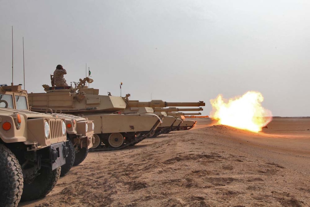 An M1A2 Abrams tank fires at a target at a live-fire range near Camp Buehring, during Exercise Eager Mace 13, Nov. 13. Marines from Tanks Platoon, India Company, Battalion Landing Team 3/5, 15th Marine Expeditionary Unit, alongside the U.S. Army, were teaching members of the Kuwait Armed Forces in the operation of the tanks. The U.S. Navy and Marine Corps are participating in the bilateral training exercise with the Kuwait Armed Forces to expand levels of cooperation, enhance mutual maritime capabilities and promote long-term regional stability and interoperability between U.S. forces and regional partners. The 15th MEU is deployed as part of the Peleliu Amphibious Ready Group as a U.S. Central Command theater reserve force, providing support for maritime security operations and theater security cooperation efforts in the U.S. 5th Fleet area of responsibility. (U.S. Marine Corps photo by Cpl. Timothy Childers/Released)