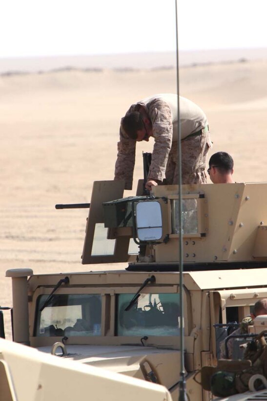 Marines from Combined Anti-Armor Team 2, Weapons Company, Battalion Landing Team 3/5, 15th Marine Expeditionary Unit, load .50 caliber machine gun at a live-fire range near Camp Buehring, during Exercise Eager Mace 13, Nov. 14. The Marines alongside the U.S. Army were instructing members of the Kuwait Armed Forces how to assault an enemy force. The U.S. Navy and Marine Corps are participating in the bilateral training exercise with the Kuwait Armed Forces to expand levels of cooperation, enhance mutual maritime capabilities and promote long-term regional stability and interoperability between U.S. forces and regional partners. The 15th MEU is deployed as part of the Peleliu Amphibious Ready Group as a U.S. Central Command theater reserve force, providing support for maritime security operations and theater security cooperation efforts in the U.S. 5th Fleet area of responsibility. (U.S. Marine Corps photo by Cpl. Timothy Childers/Released)