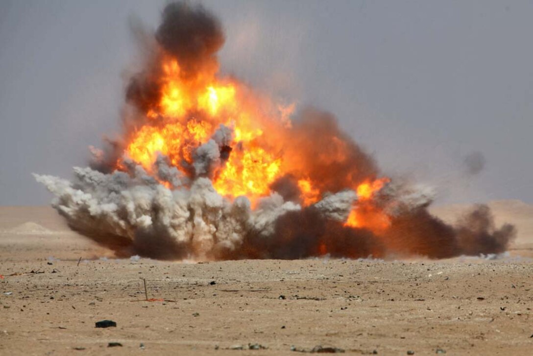 A cratering charge detonates when Marines assigned to Engineer Detachment, Combat Logistics Battalion 15, 15th Marine Expeditionary Unit, conducted a controlled detonation exercise at a live-fire range near Camp Buehring, Kuwait, during a routine training exercise, Nov. 25. With the use of shape and cratering charges and composition C-4, the combat engineers were able to use the high explosives to demonstrate practical applications they could use in a combat environment. The 15th MEU is deployed as part of the Peleliu Amphibious Ready Group as a U.S. Central Command theater reserve force, providing support for maritime security operations and theater security cooperation efforts in the U.S. 5th Fleet area of responsibility. (U.S. Marine Corps photo by Cpl. Timothy R. Childers)