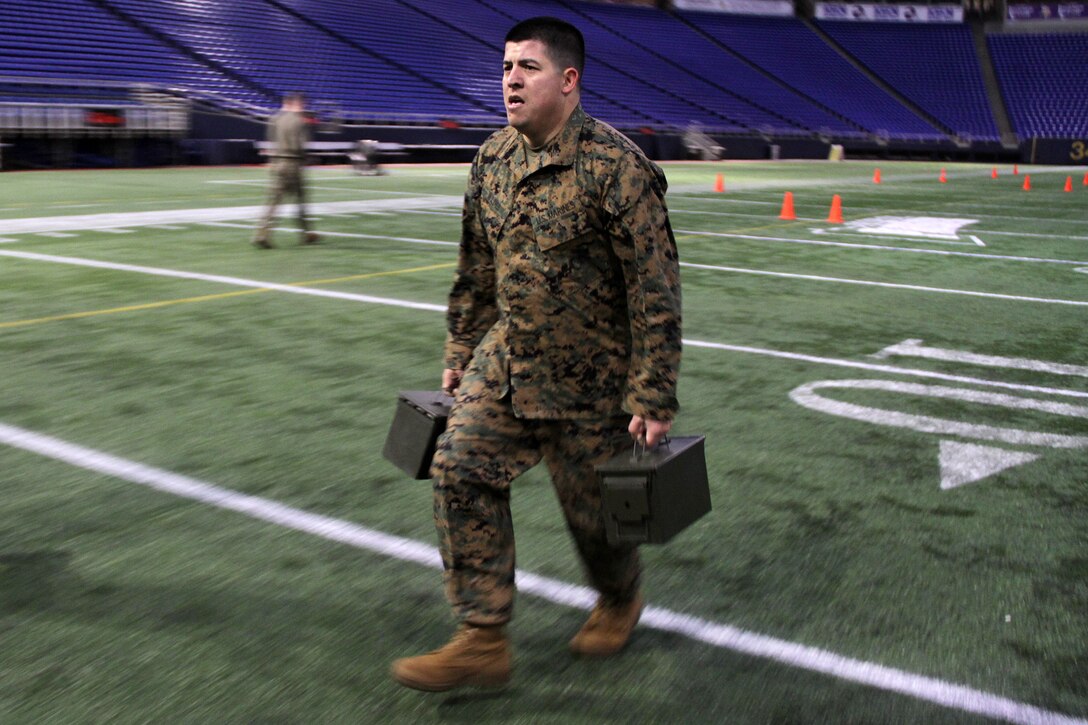 Staff Sgt. Jowa Wildes, 33, from Palmdale, Calif., completes the maneuver under fire portion of his combat fitness test at the Metrodome on Nov. 21. Wildes is the staff noncommissioned officer-in-charge of the Roseville, Minn., recruiting office. For additional imagery from the event, visit www.facebook.com/rstwincities.