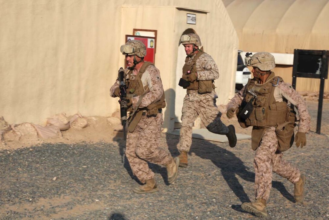 U.S. servicemembers assigned to Combat Logistics Battalion 15, 15th Marine Expeditionary Unit, run to simulated casualties  during a combat life-saving class at Camp Buehring, Kuwait, during Exercise Eager Mace 13, Nov. 21. The U.S. Navy and Marine Corps are participating in the bilateral training exercise with the Kuwait Armed Forces to expand levels of cooperation, enhance mutual maritime capabilities and promote long-term regional stability and interoperability between U.S. forces and regional partners. The 15th MEU is deployed as part of the Peleliu Amphibious Ready Group as a U.S. Central Command theater reserve force, providing support for maritime security operations and theater security cooperation efforts in the U.S. 5th Fleet area of responsibility. (U.S. Marine Corps photo by Cpl. Timothy R. Childers/Released)