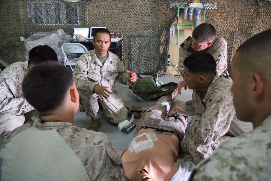 Petty Officer 2nd Class William Imperial, corpsman, Combat Logistics Battalion 15, 15th Marine Expeditionary Unit, teaches a combat life-saving class at Camp Buehring, Kuwait, during Exercise Eager Mace 13, Nov. 21. The U.S. Navy and Marine Corps are participating in the bilateral training exercise with the Kuwait Armed Forces to expand levels of cooperation, enhance mutual maritime capabilities and promote long-term regional stability and interoperability between U.S. forces and regional partners. The 15th MEU is deployed as part of the Peleliu Amphibious Ready Group as a U.S. Central Command theater reserve force, providing support for maritime security operations and theater security cooperation efforts in the U.S. 5th Fleet area of responsibility. Imperial, 25, is from Manila, Philippines. (U.S. Marine Corps photo by Cpl. Timothy R. Childers/Released)