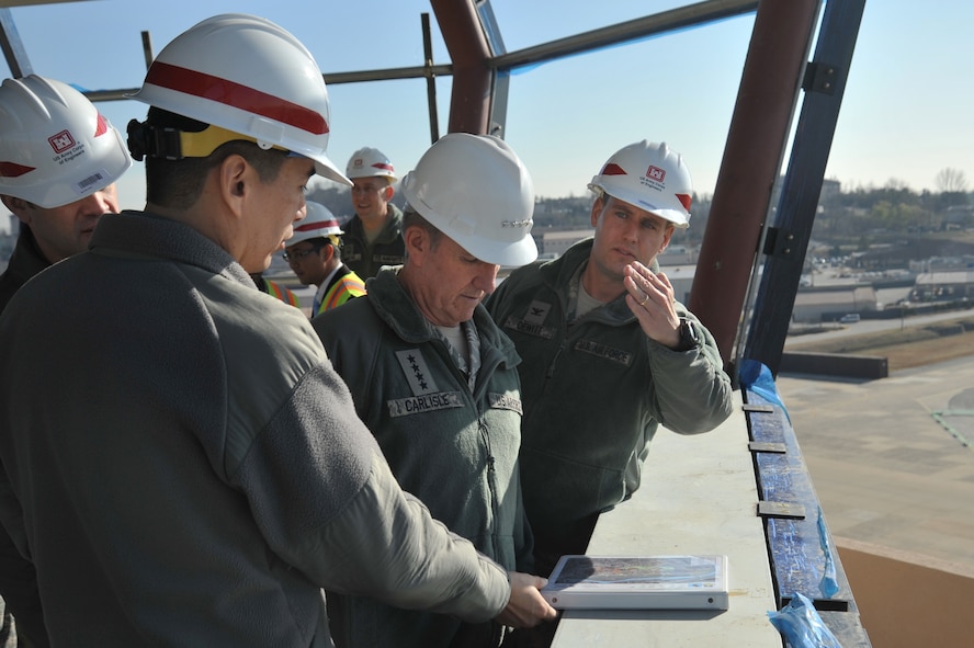 Col. Sean DeWitt (right), 51st Fighter Wing vice commander, and Lt. Col. Roland Secody (left), 51st Civil Engineer Squadron commander, explain the purpose of a newly constructed tower project to Gen. Herbert J. Carlisle, Pacific Air Forces commander, during his visit to Osan Air Base, Republic of Korea, Nov. 29, 2012. The project is still in the construction stage with an estimated completion date of March 2013. (U.S. Air Force photo/Staff Sgt. Craig Cisek)