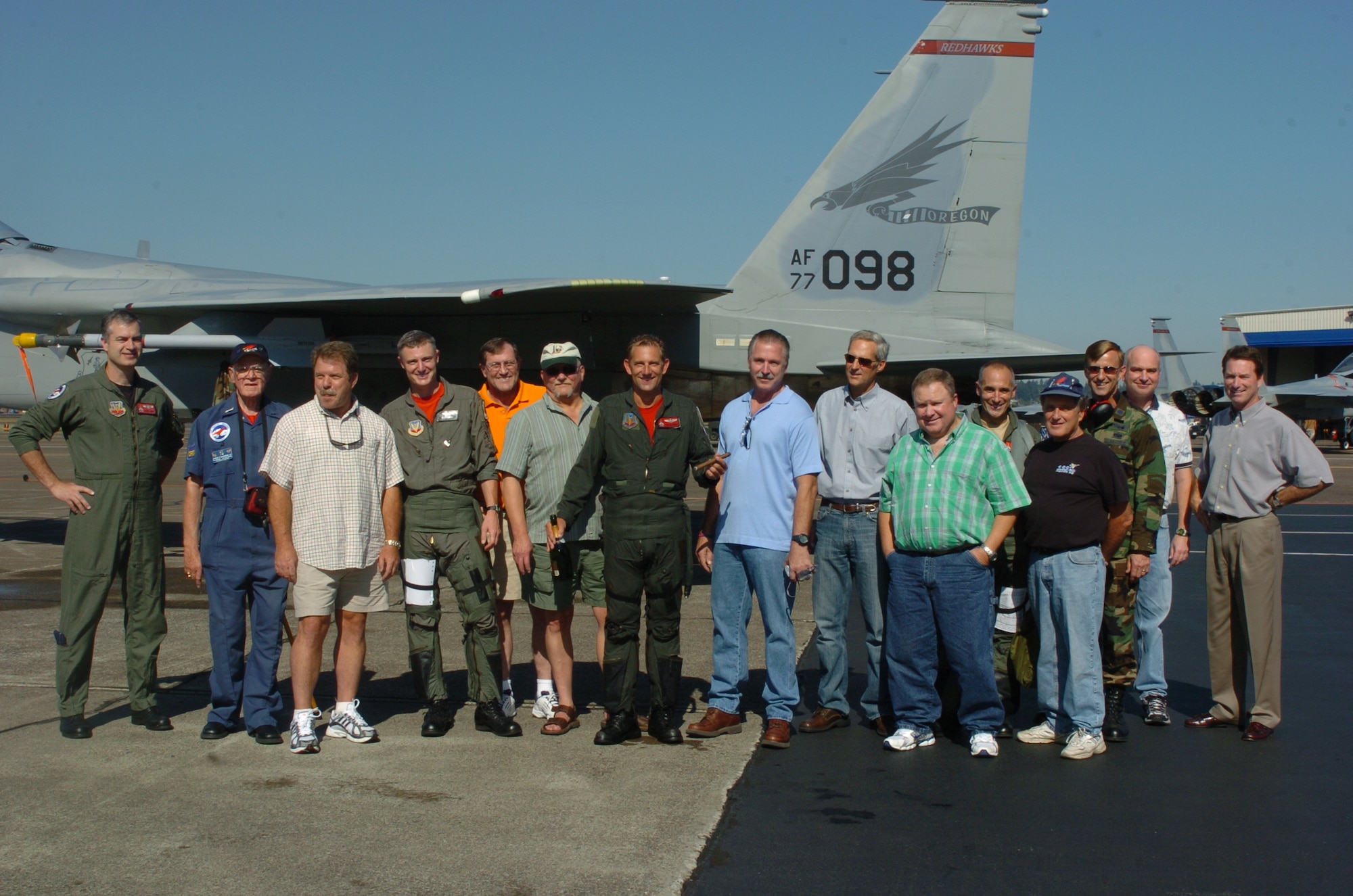 Oregon Air National Lt. Col. Gary Thompson (third from the right) stands with group of family and friends of Lt. Col. (ret.) Dave McKinney (center) after his Fini Flight on Sept. 27, 2006 at the Portland Air National Guard Base, Portland, Ore. McKinney and Thompson won the Top Gun and Top Shooter awards at the 1988 William Tell Weapons meet at Tyndall AFB, Fla. (U.S. Air Force photo by Tech. Sgt. Todd Enlund (ret.) 142nd Fighter Multimedia department / released)  
